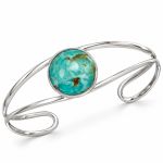 Sterling silver open cuff bracelet with a large round blue-green turquoise center stone.