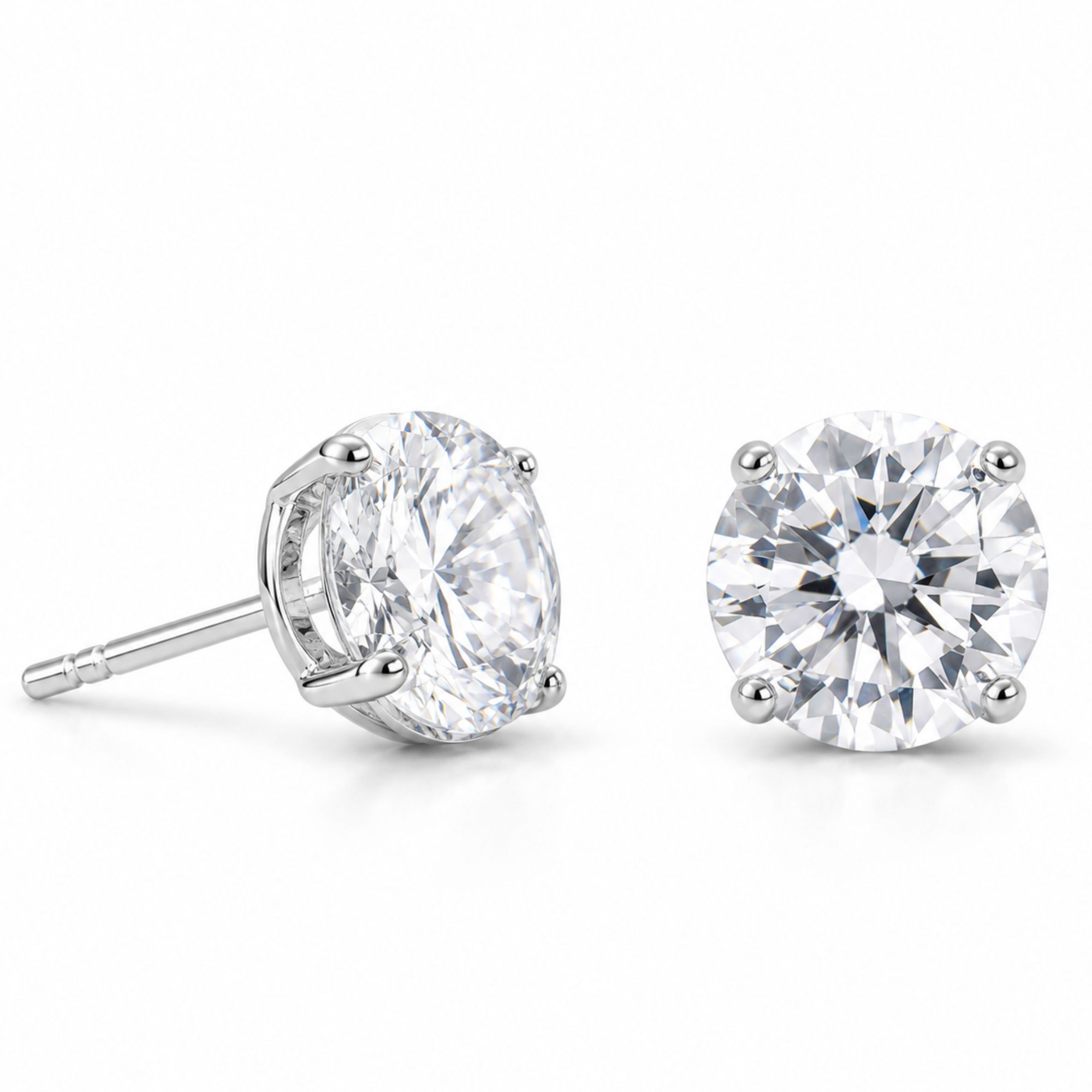 Pair of large round clear CZ stud earrings in silver-tone settings, shown from front and side.