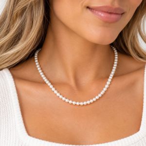 Single-strand white cultured freshwater pearl necklace with small round pearls and a short necklace length.